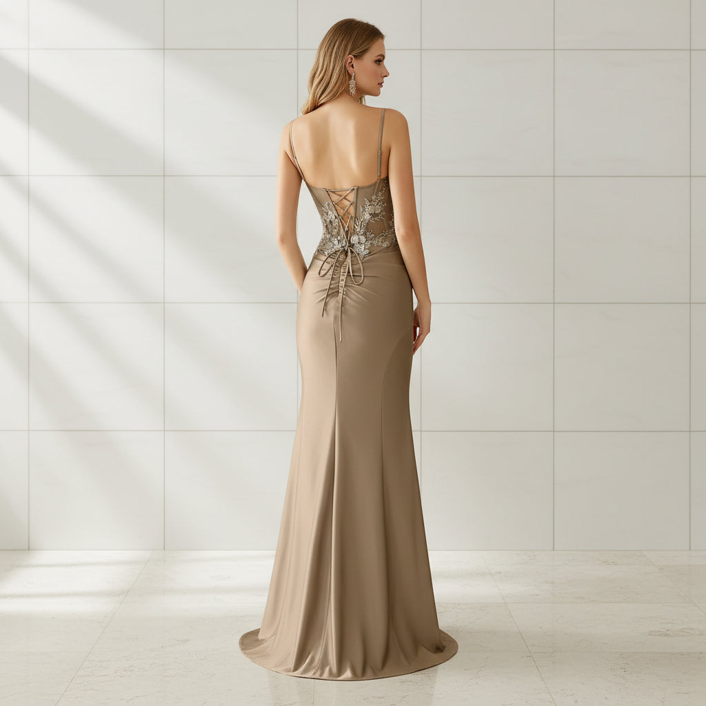 Beige evening gown with floral lace details on a white background
