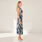 Woman wearing a blue and beige patterned dress on a white background