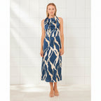 Woman wearing a blue and beige patterned dress on a white background