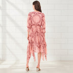 Angled view of women's bandana print handkerchief midi dress