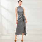 Woman wearing a patterned dress on a white background