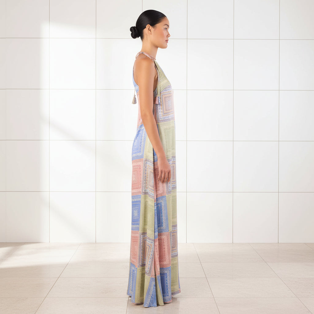 Woman wearing a colorful patterned dress on a white background